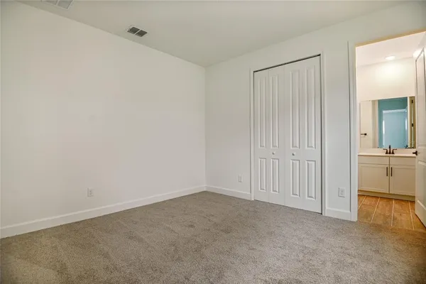 an empty room with a bathroom