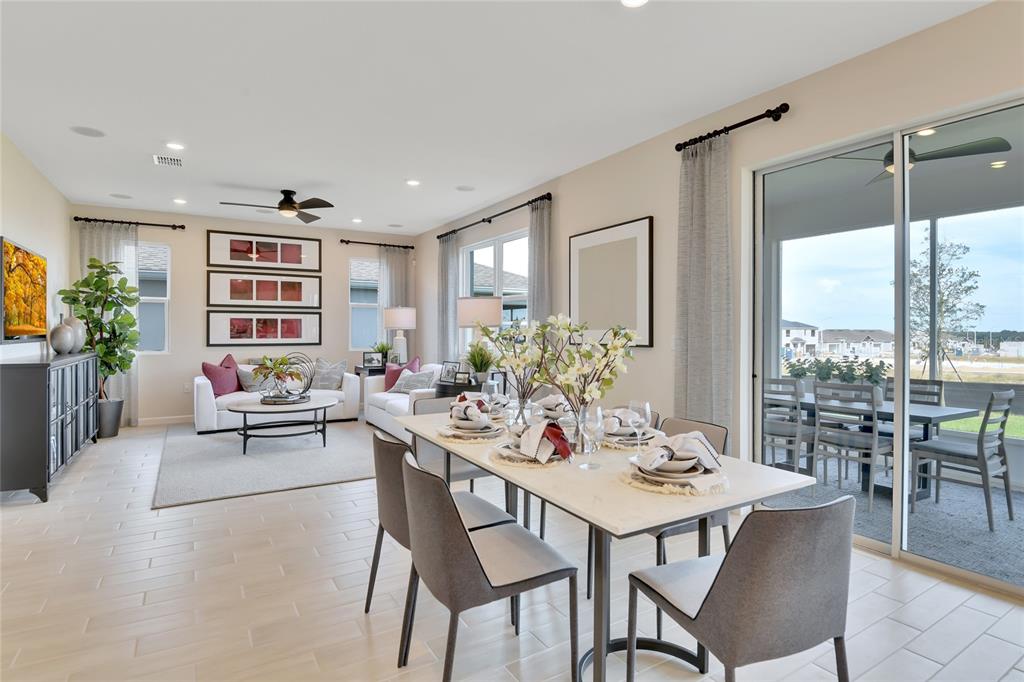 176 Blue Star Court Tavares, FL 32778 - Photo 6 of 21 a view of a dining room with furniture window and outside view