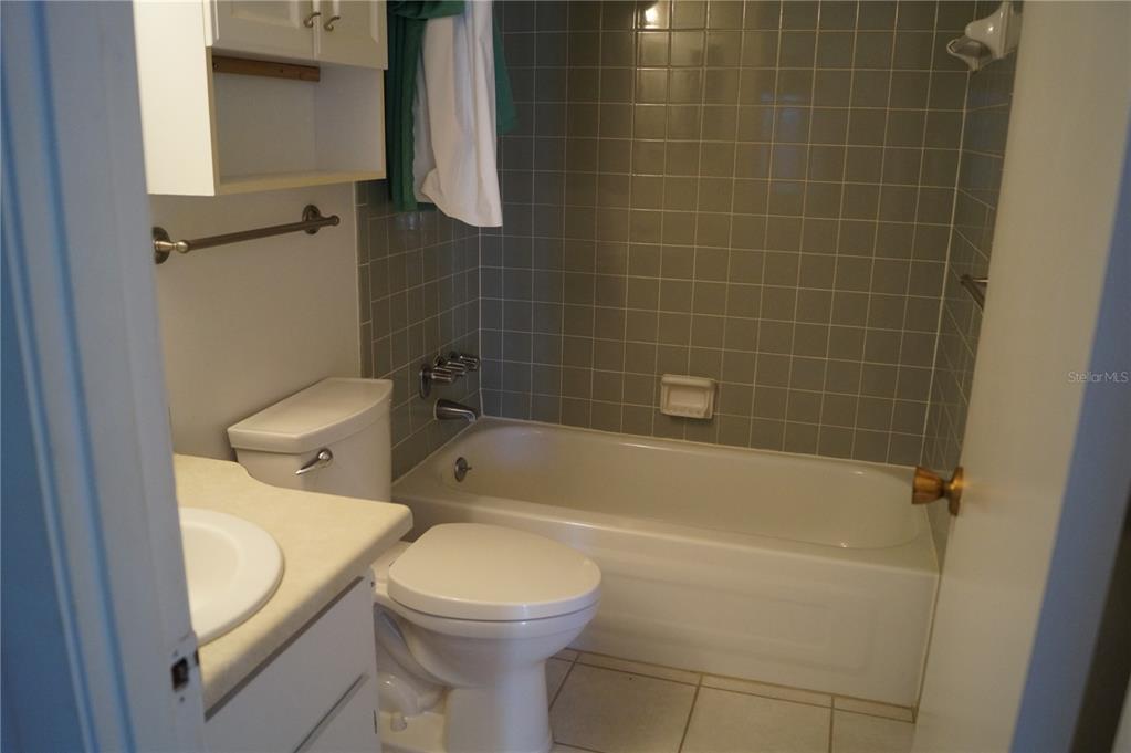 7701 Starkey Road, Unit 408 Seminole, FL 33777 - Photo 19 of 28 a bathroom with a toilet and bathtub
