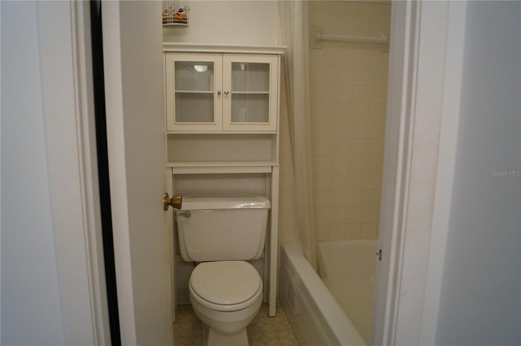 7701 Starkey Road, Unit 408 Seminole, FL 33777 - Photo 27 of 28 a bathroom with a toilet and a sink