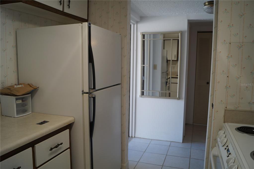 7701 Starkey Road, Unit 408 Seminole, FL 33777 - Photo 5 of 28 a view of bathroom with a sink and a mirror
