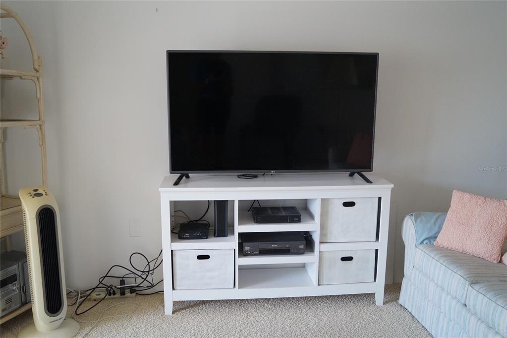 7701 Starkey Road, Unit 408 Seminole, FL 33777 - Photo 9 of 28 a view of an empty room with furniture and storage