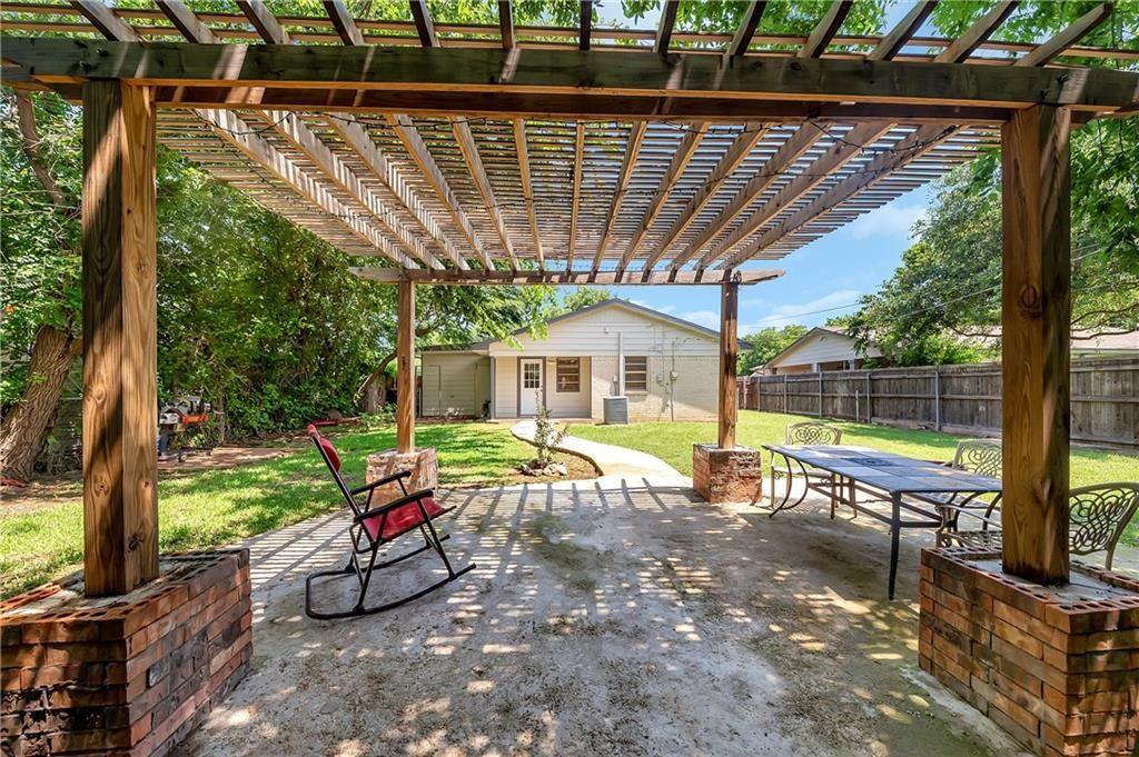712 Ridgecrest Drive Lewisville, TX 75067 - Photo 12 of 12 a view of backyard with swimming pool and seating space