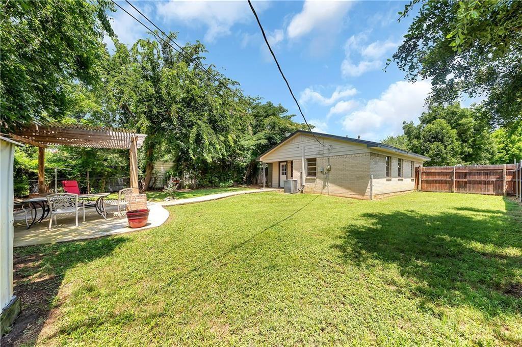 712 Ridgecrest Drive Lewisville, TX 75067 - Photo 6 of 12 a view of house with backyard and sitting area