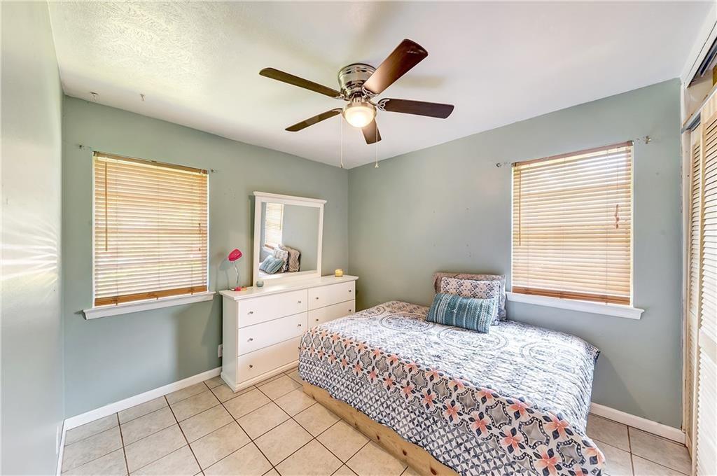 712 Ridgecrest Drive Lewisville, TX 75067 - Photo 10 of 12 a bedroom with a bed and a window