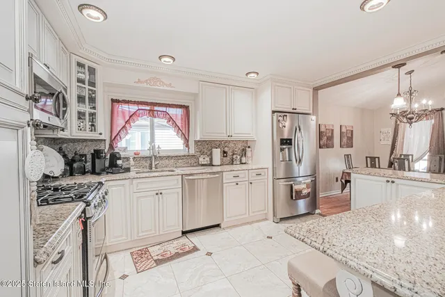 a kitchen with refrigerator and cabinets