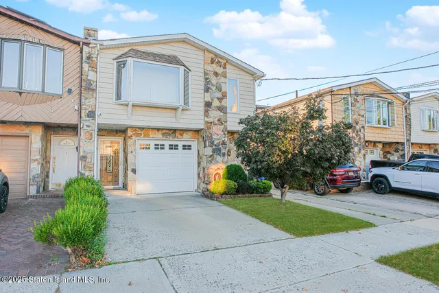 a front view of a building with garden