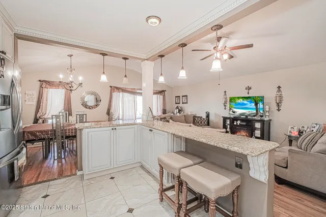 a kitchen with a table and chairs in it