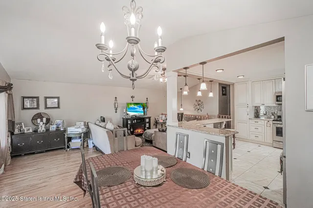 a large kitchen with a table and chairs