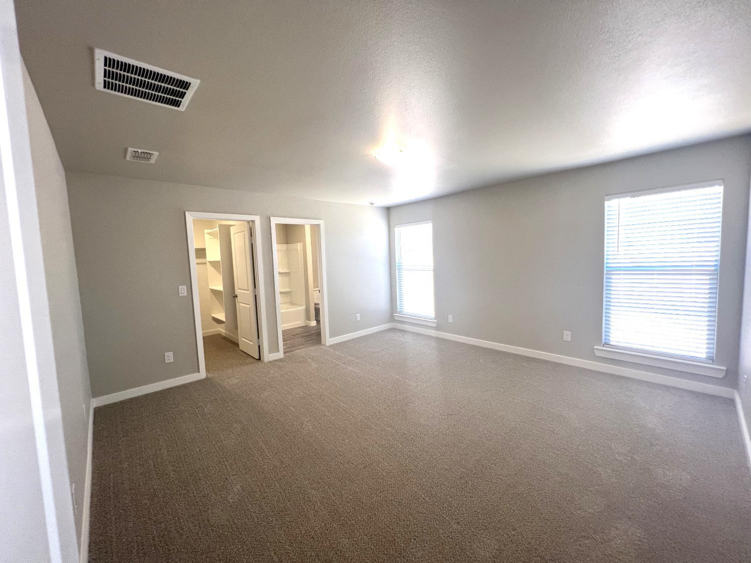 13705 Avenue Q Lubbock, TX 79423 - Photo 11 of 13 a view of an empty room with a window