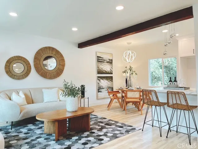 a dining room with furniture and wooden floor