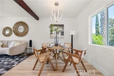 a spacious bedroom with a bed a couch and a window