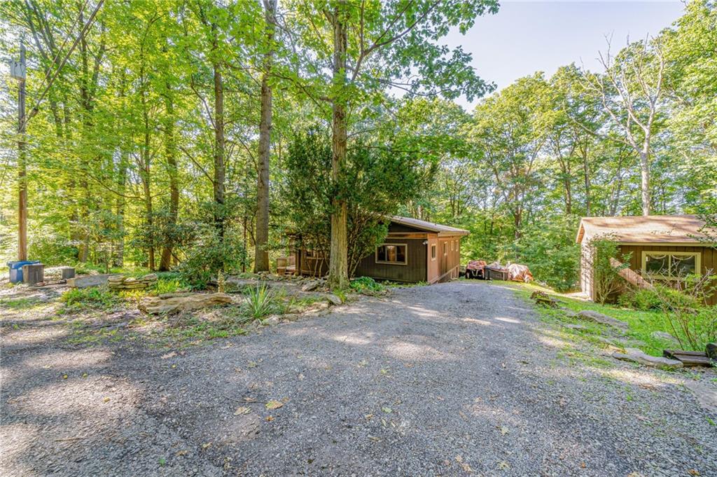 218 Horse Shoe Bend Road Acme, PA 15610 - Photo 2 of 31 a view of a house with a yard and tree s