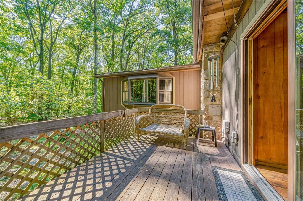 218 Horse Shoe Bend Road Acme, PA 15610 - Photo 24 of 31 a view of backyard with a deck and wooden floor