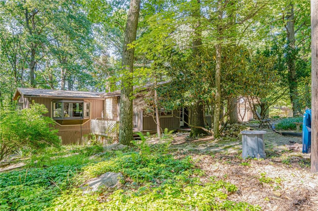 218 Horse Shoe Bend Road Acme, PA 15610 - Photo 26 of 31 a backyard of a house with seating space