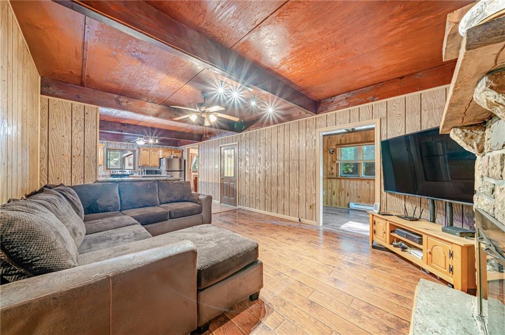 218 Horse Shoe Bend Road Acme, PA 15610 - Photo 9 of 31 a living room with furniture a flat screen tv and a table