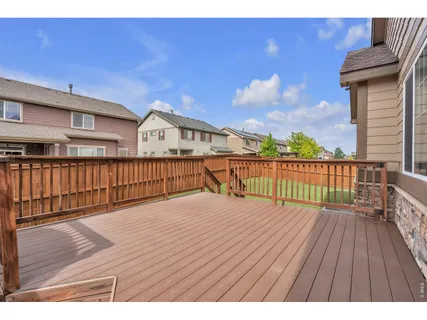 a view of a house with wooden deck