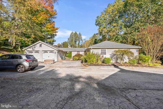 a view of a house with a yard and balcony
