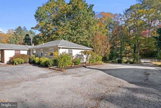 a front view of a house with a yard and a garage