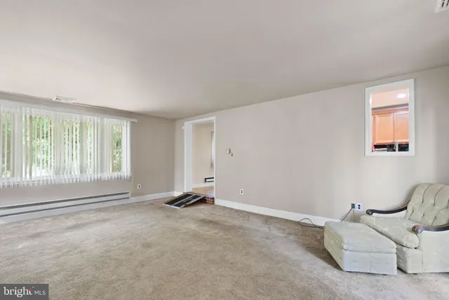 a view of room with window and a couch
