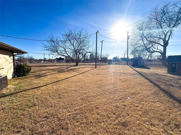 a view of a yard with an outdoor space