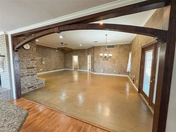a view of a hallway with a large mirror