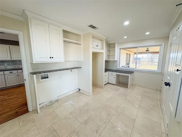 a view of a kitchen with electric appliances