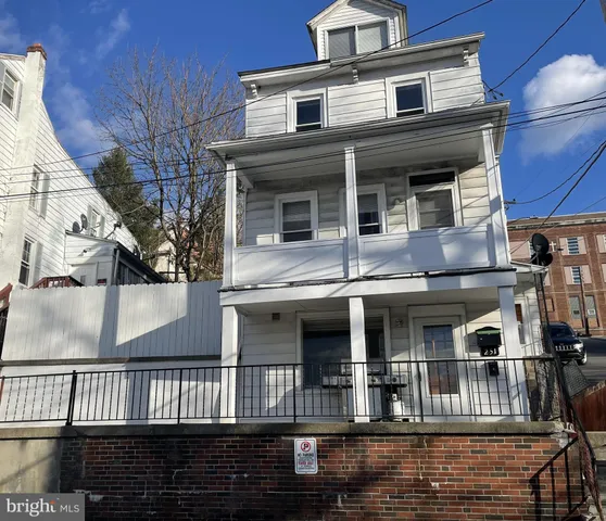 a front view of a house with balcony