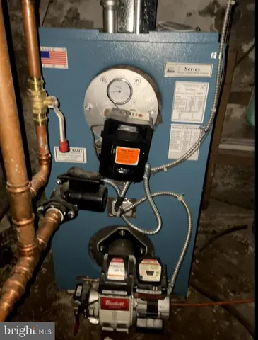 a living room with furniture and a mirror