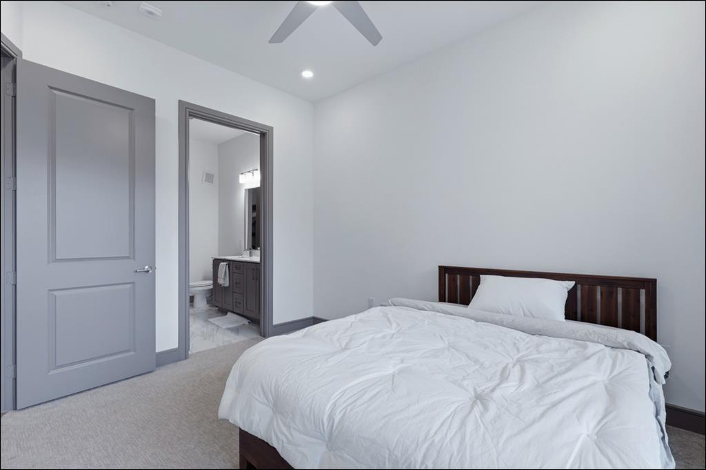 2700 Old Denton Road, Unit 2272 Carrollton, TX 75007 - Photo 11 of 40 a bedroom with a bed and a mirror