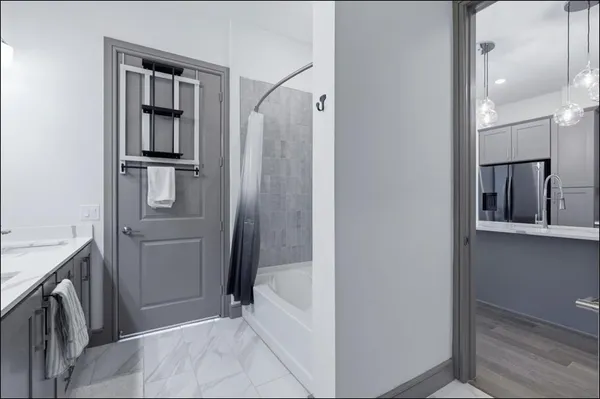 a bathroom with a bathtub and a sink