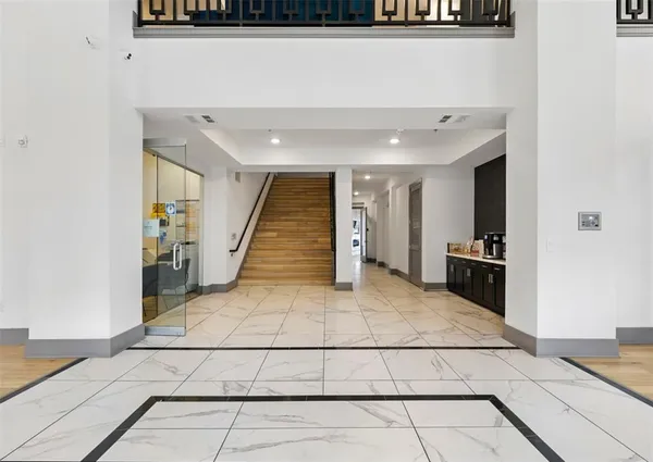 a view of living room with furniture and flat screen tv