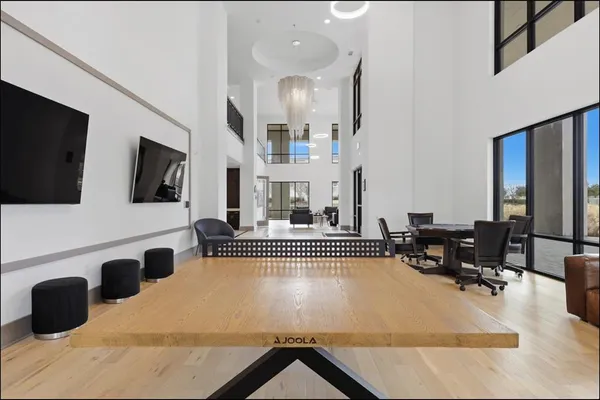 a view of a dining room with furniture and a rug