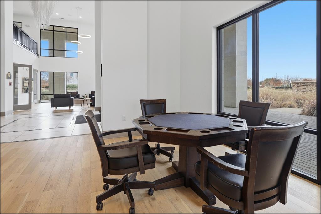 2700 Old Denton Road, Unit 2272 Carrollton, TX 75007 - Photo 20 of 40 a view of a dining room with furniture and a rug