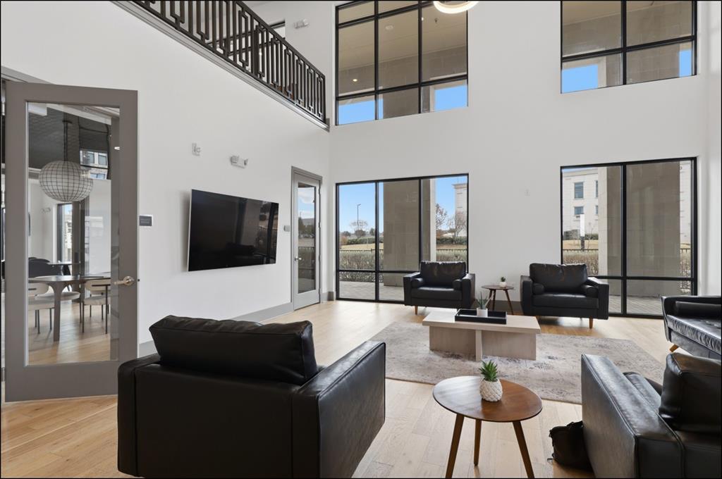 2700 Old Denton Road, Unit 2272 Carrollton, TX 75007 - Photo 21 of 40 a living room with furniture and a flat screen tv