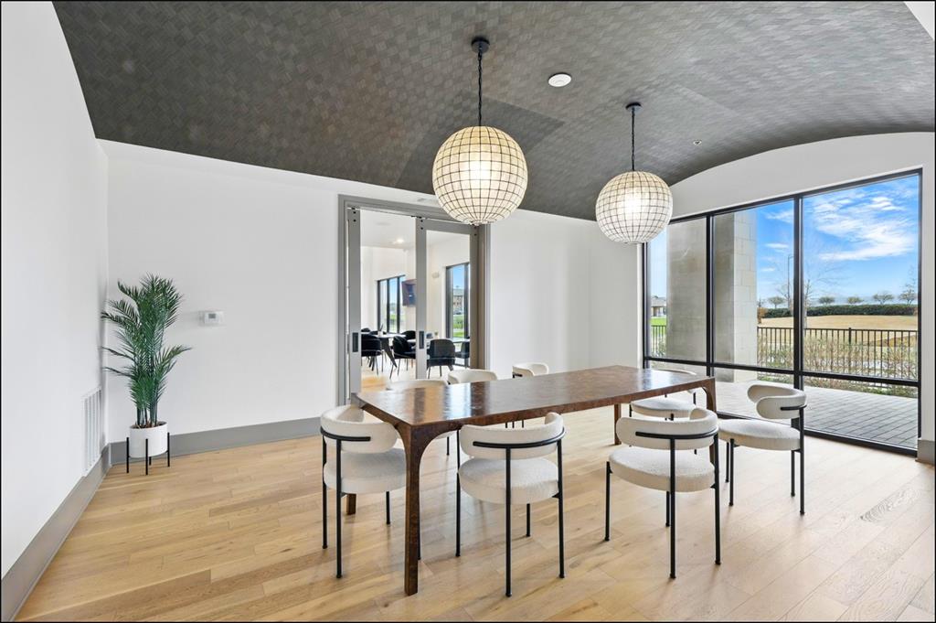 2700 Old Denton Road, Unit 2272 Carrollton, TX 75007 - Photo 22 of 40 a view of a dining room with furniture and wooden floor