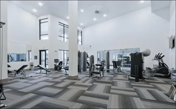 a view of a livingroom with furniture and a flat screen tv