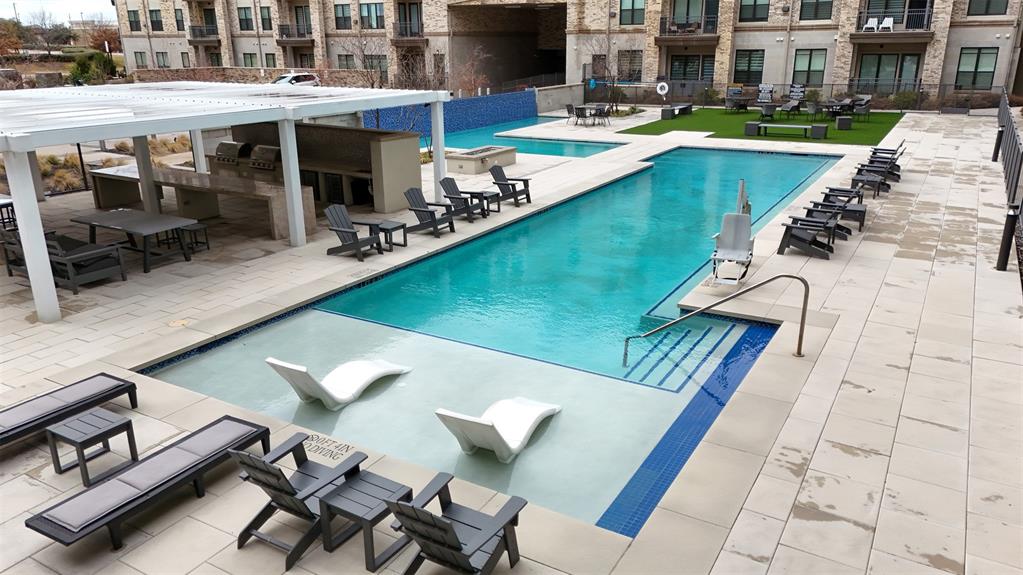 2700 Old Denton Road, Unit 2272 Carrollton, TX 75007 - Photo 36 of 40 a view of a patio with swimming pool table and chairs