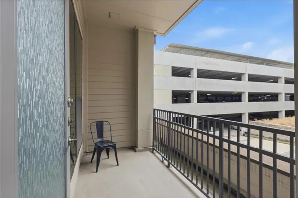 a view of balcony with a potted plant