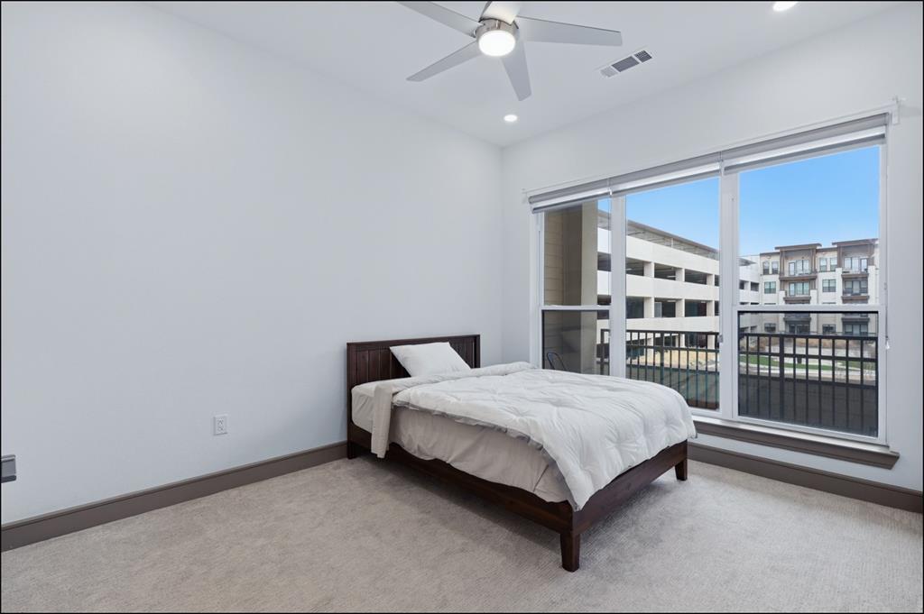 2700 Old Denton Road, Unit 2272 Carrollton, TX 75007 - Photo 10 of 40 a bed sitting in a room next to a window