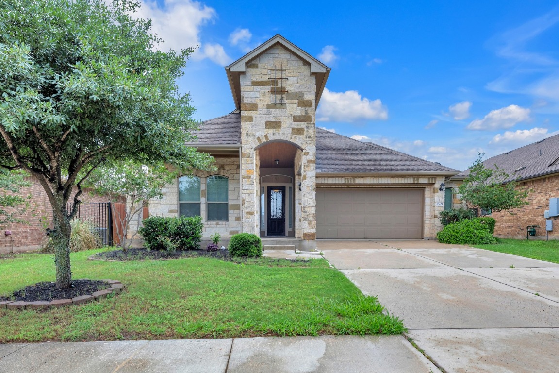 a front view of a house with garden