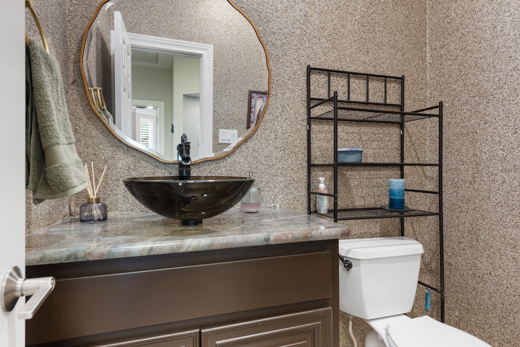 664 Ranchers Club Lane Driftwood, TX 78619 - Photo 13 of 40 a bathroom with a toilet sink and mirror