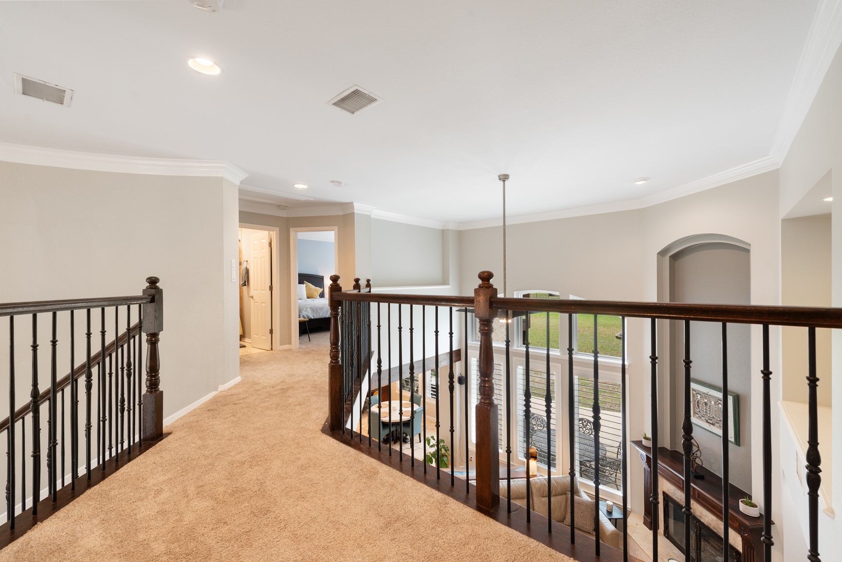 664 Ranchers Club Lane Driftwood, TX 78619 - Photo 14 of 40 a view of a hallway with wooden floor and windows