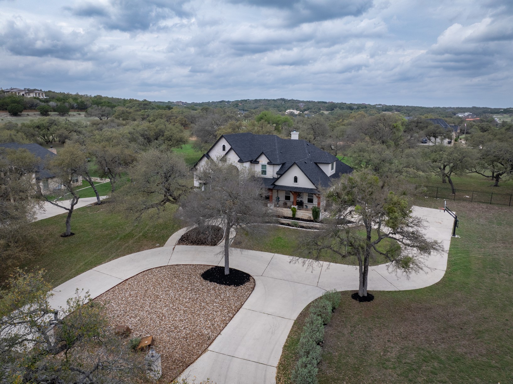 664 Ranchers Club Lane Driftwood, TX 78619 - Photo 27 of 40 a view of a garden