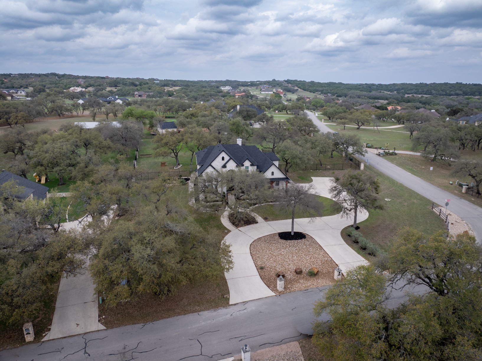 664 Ranchers Club Lane Driftwood, TX 78619 - Photo 29 of 40 an aerial view of a house with a yard