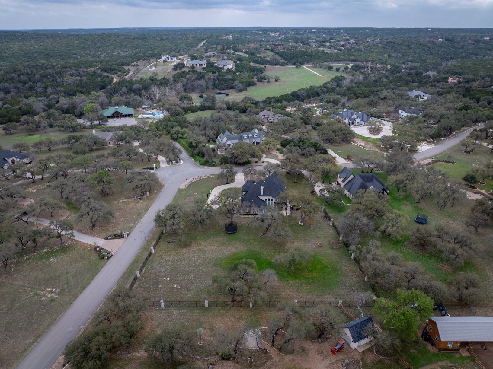 664 Ranchers Club Lane Driftwood, TX 78619 - Photo 32 of 40 a view of a yard with wooden fence