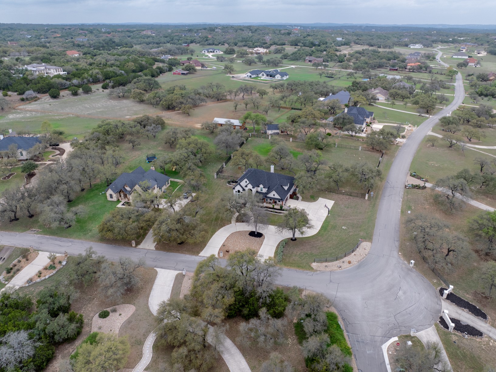 664 Ranchers Club Lane Driftwood, TX 78619 - Photo 37 of 40 an aerial view of a house with a yard