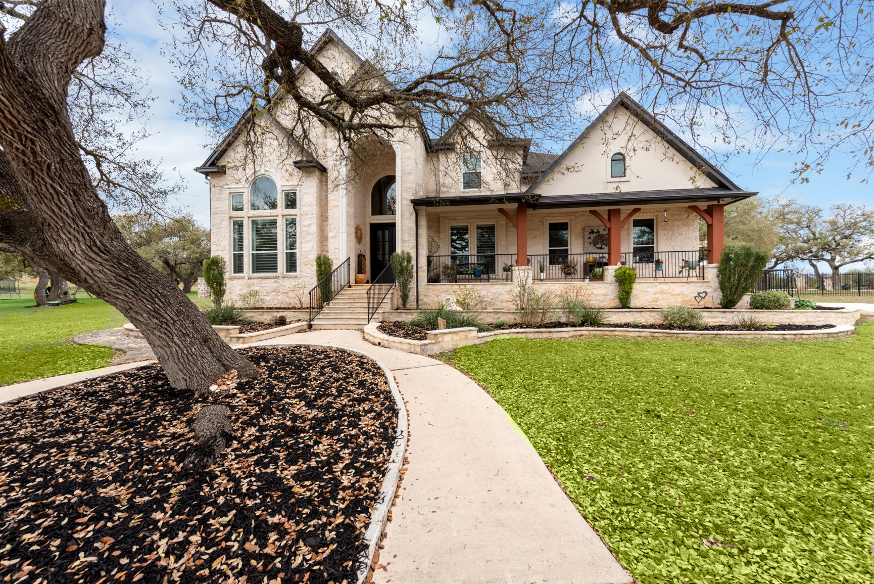 664 Ranchers Club Lane Driftwood, TX 78619 - Photo 39 of 40 a front view of a house with garden