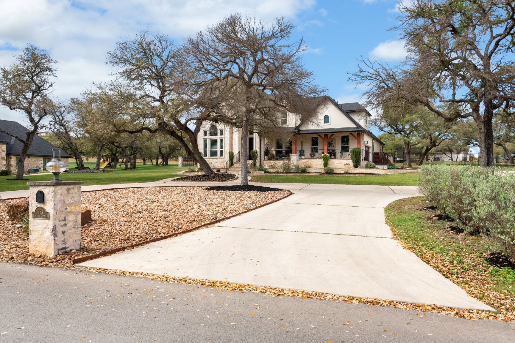664 Ranchers Club Lane Driftwood, TX 78619 - Photo 5 of 40 a view of a yard with plants and trees
