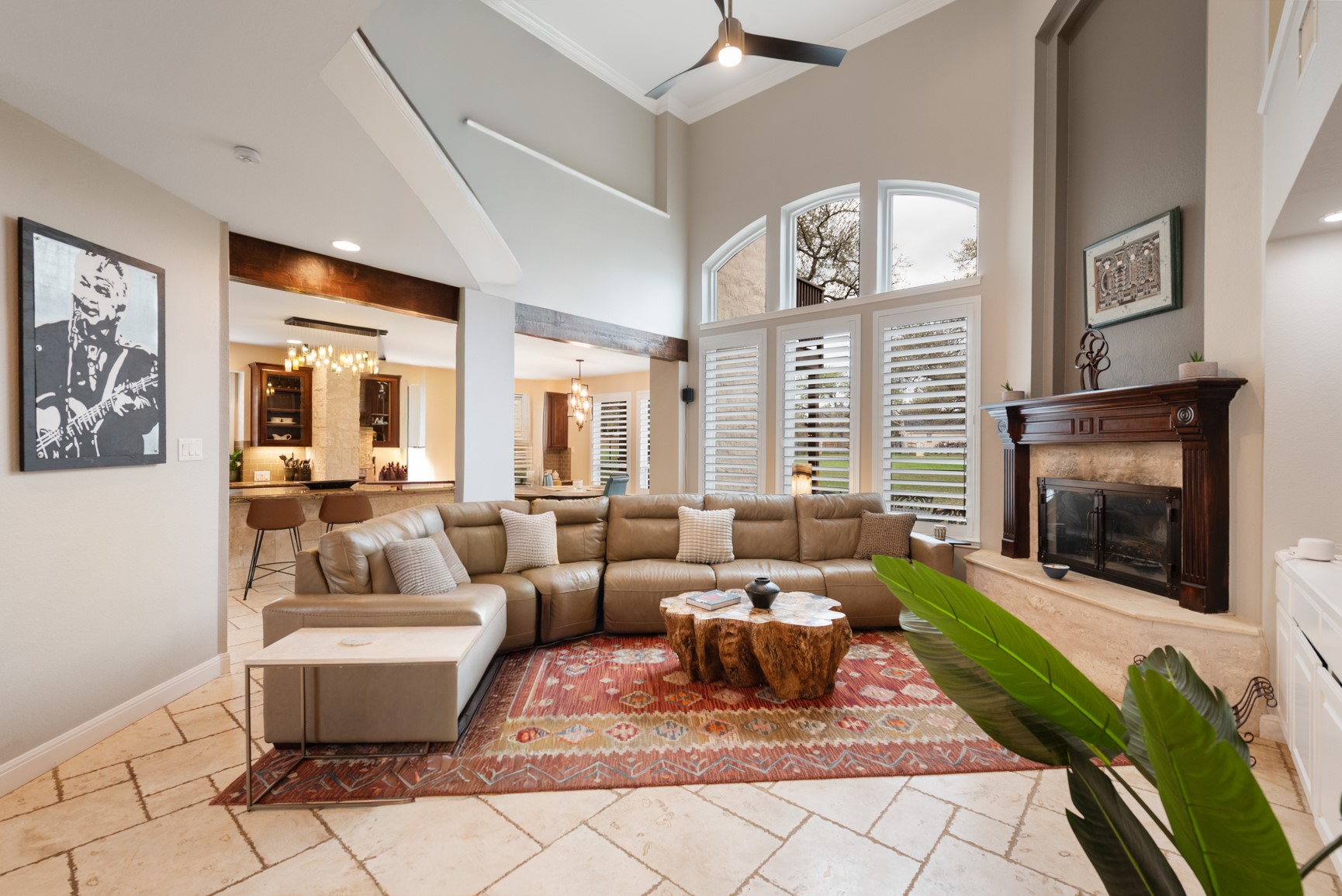 664 Ranchers Club Lane Driftwood, TX 78619 - Photo 6 of 40 a living room with furniture a flat screen tv and a fireplace